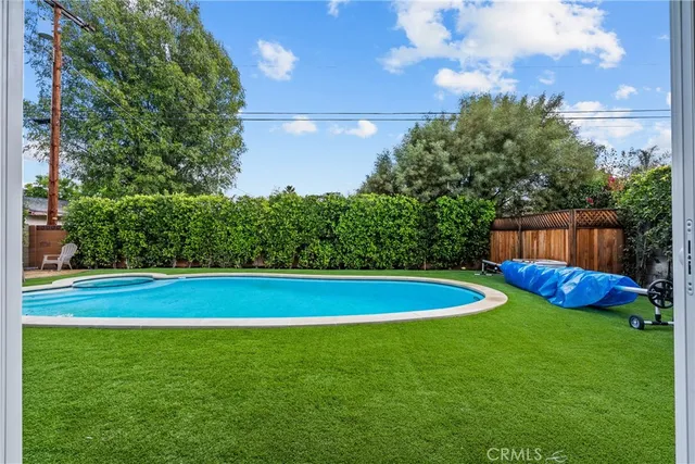 a view of a house with a yard porch and sitting area