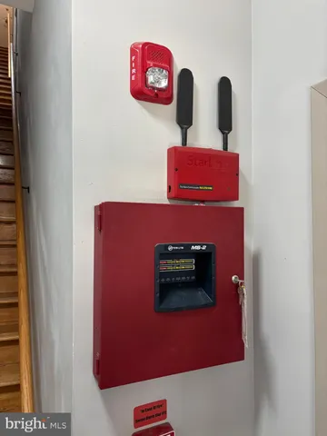 a view of a patio with a table and chairs and potted plants