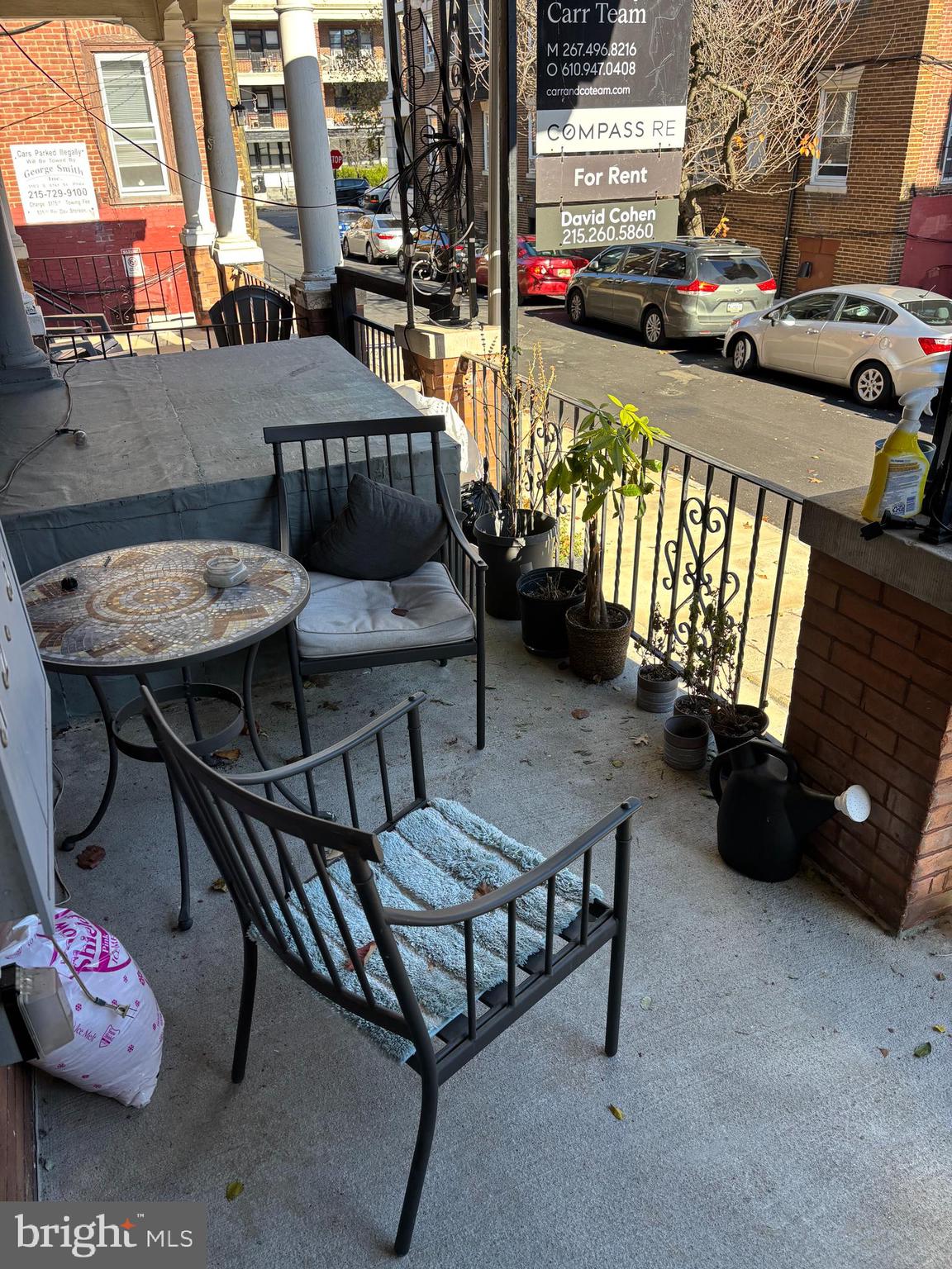 216 Buckingham Place, Unit 2 Philadelphia, PA 19104 - Photo 17 of 18 a view of a patio with a table and chairs and potted plants