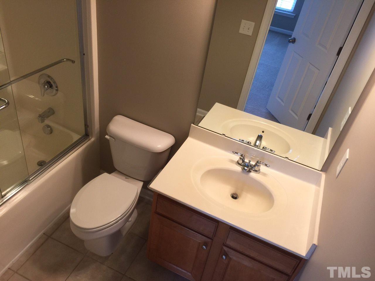 2742 Laurel Cherry Street Raleigh, NC 27612 - Photo 19 of 25 This private bath is for the second upstairs bedroom.