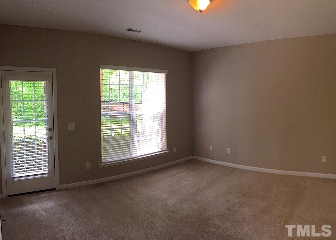 2742 Laurel Cherry Street Raleigh, NC 27612 - Photo 20 of 25 This bedroom is on the ground level and has access to the outside. A large double door closet and a private full bath.