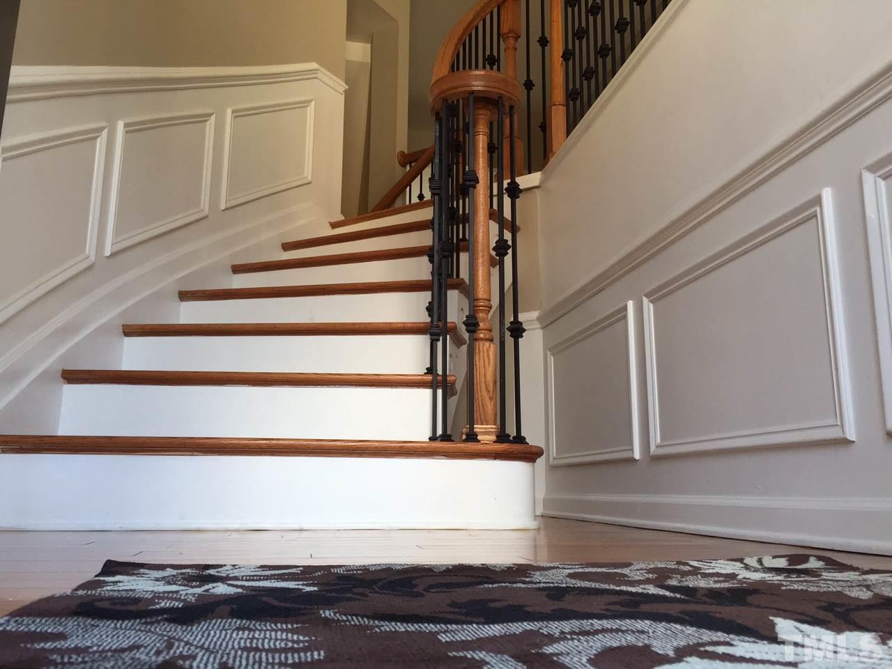 2742 Laurel Cherry Street Raleigh, NC 27612 - Photo 4 of 25 Lovely curved wall with wainscoting adds an appealing architectural flair to the entry of this town home.