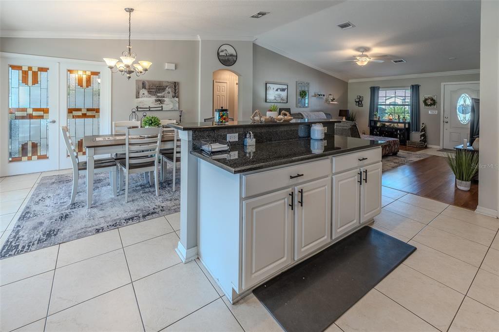 15143 Southwest 14th Avenue Road Ocala, FL 34473 - Photo 14 of 53 a kitchen with granite countertop a sink and cabinets