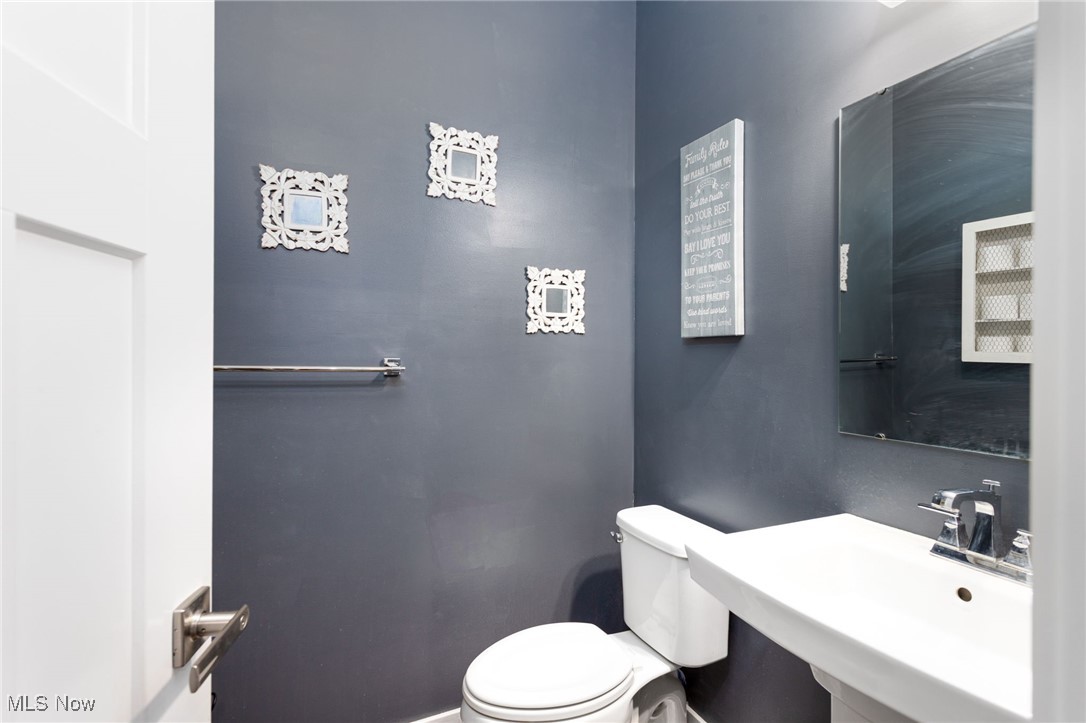 528 Oliver Way Rittman, OH 44270 - Photo 19 of 32 Half bath featuring a sink and toilet