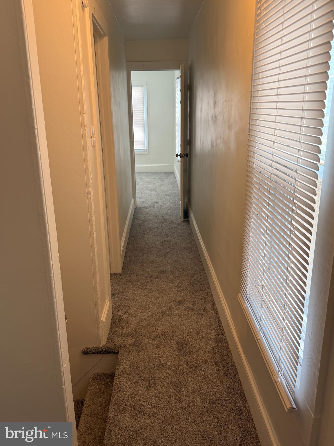 176 Griffith Street Salem, NJ 08079 - Photo 13 of 34 Bright and inviting hallway with soft carpet.