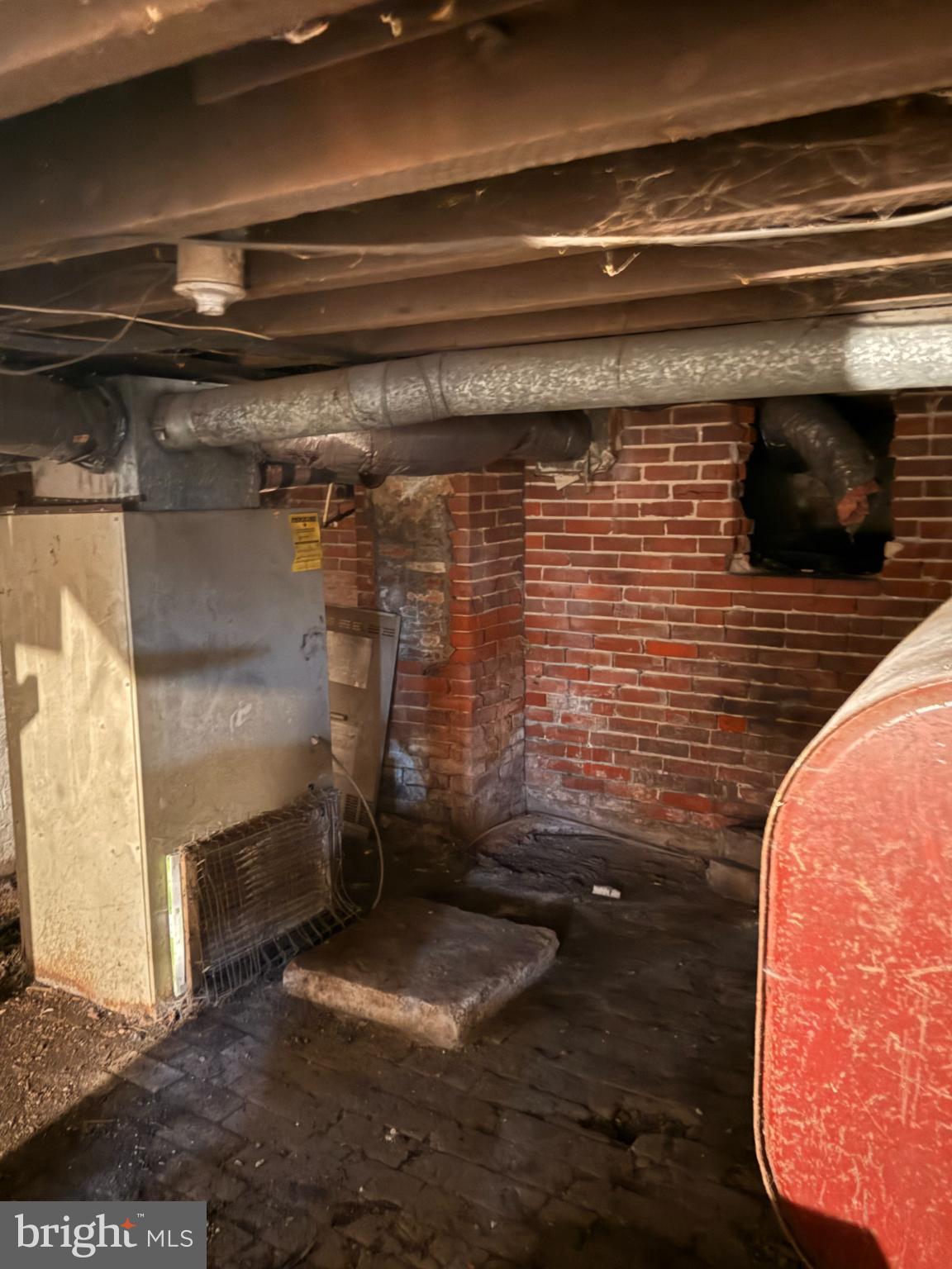 176 Griffith Street Salem, NJ 08079 - Photo 27 of 34 Basement space with exposed brick and pipes.