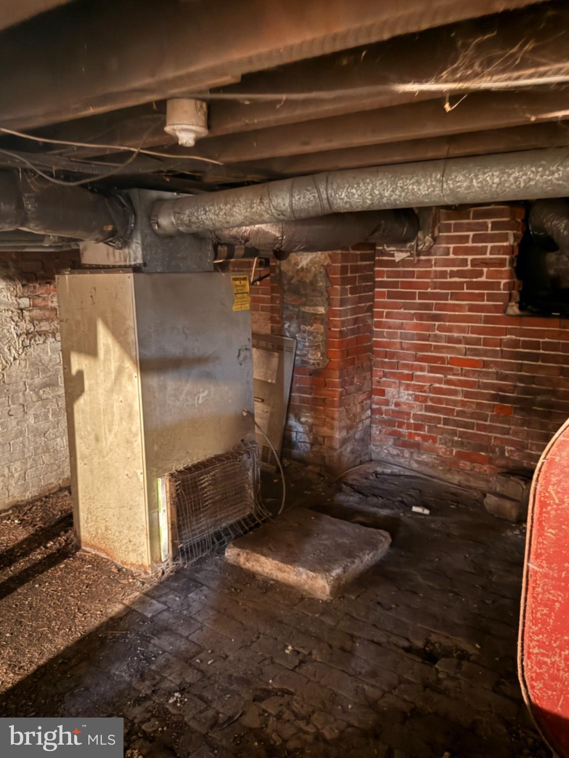 176 Griffith Street Salem, NJ 08079 - Photo 28 of 34 Basement utility area with exposed pipes.