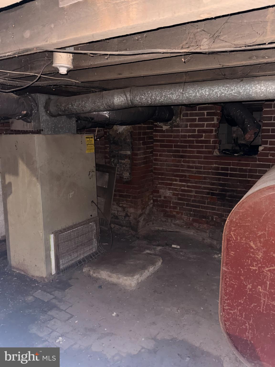 176 Griffith Street Salem, NJ 08079 - Photo 29 of 34 Basement utility area with exposed pipes.