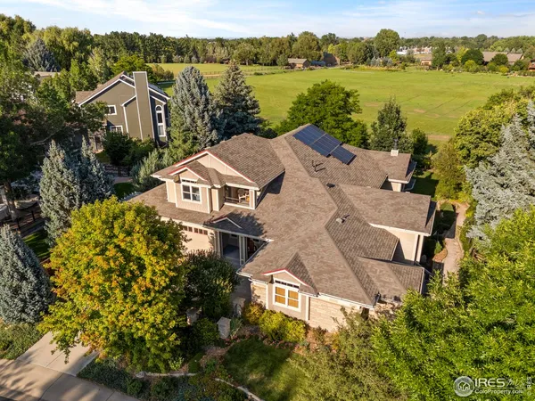 an aerial view of a house with a lake view