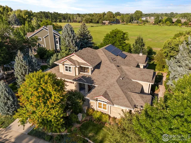 an aerial view of a house with a lake view