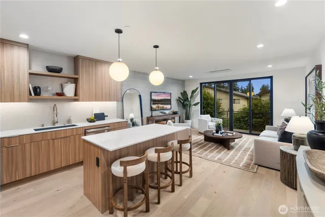 a large kitchen with a table and chairs