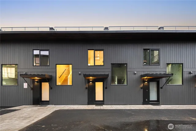 a front view of a house with barbeque area