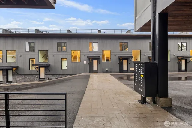 a kitchen with kitchen island a sink and wooden floor