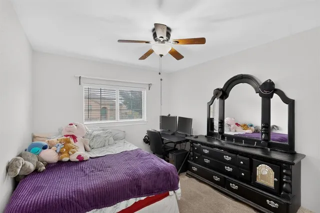 a bedroom with furniture and a window