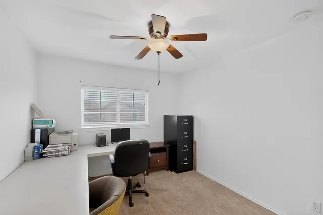 a workspace with furniture and a window