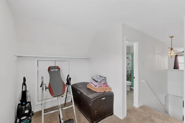 a view of room with wooden floor