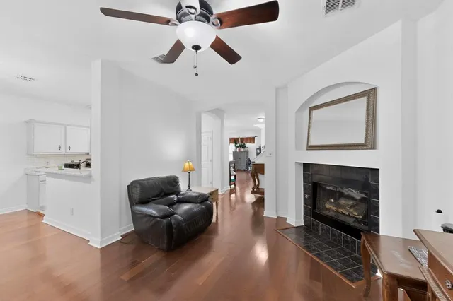 a living room with furniture and a fireplace