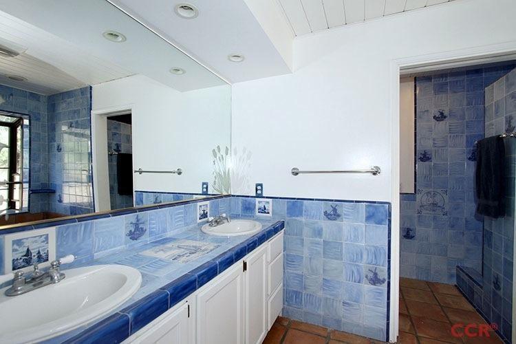 5307 Cascabel Road Atascadero, CA 93422 - Photo 15 of 25 a bathroom with a granite countertop sink a mirror and shower