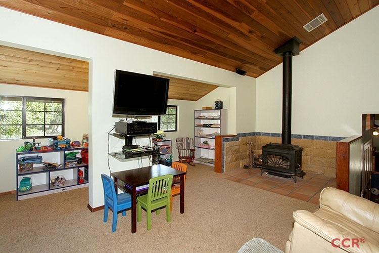 5307 Cascabel Road Atascadero, CA 93422 - Photo 17 of 25 a living room with furniture and a flat screen tv