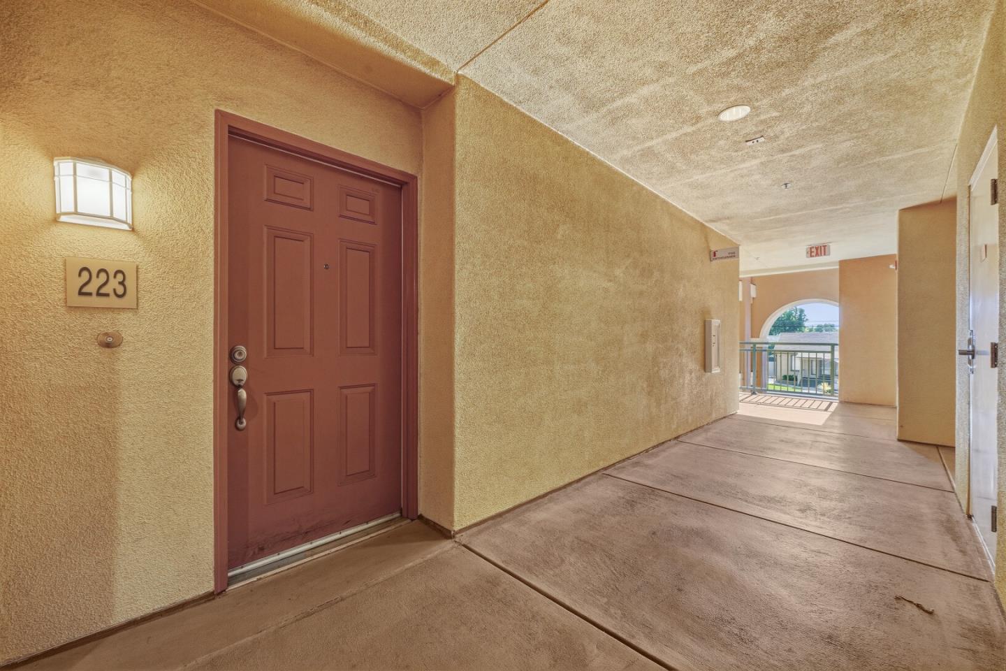 1390 Saddle Rack Street, Unit 223 San Jose, CA 95126 - Photo 23 of 36 a view of a hallway with wooden shelves