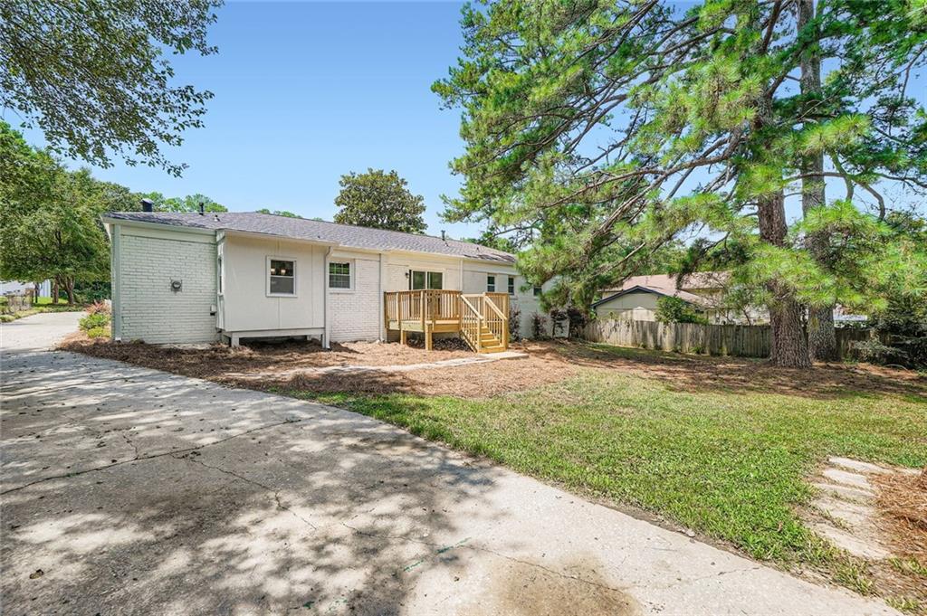 6678 Collier Way Riverdale, GA 30296 - Photo 28 of 29 a view of a house with backyard and a tree