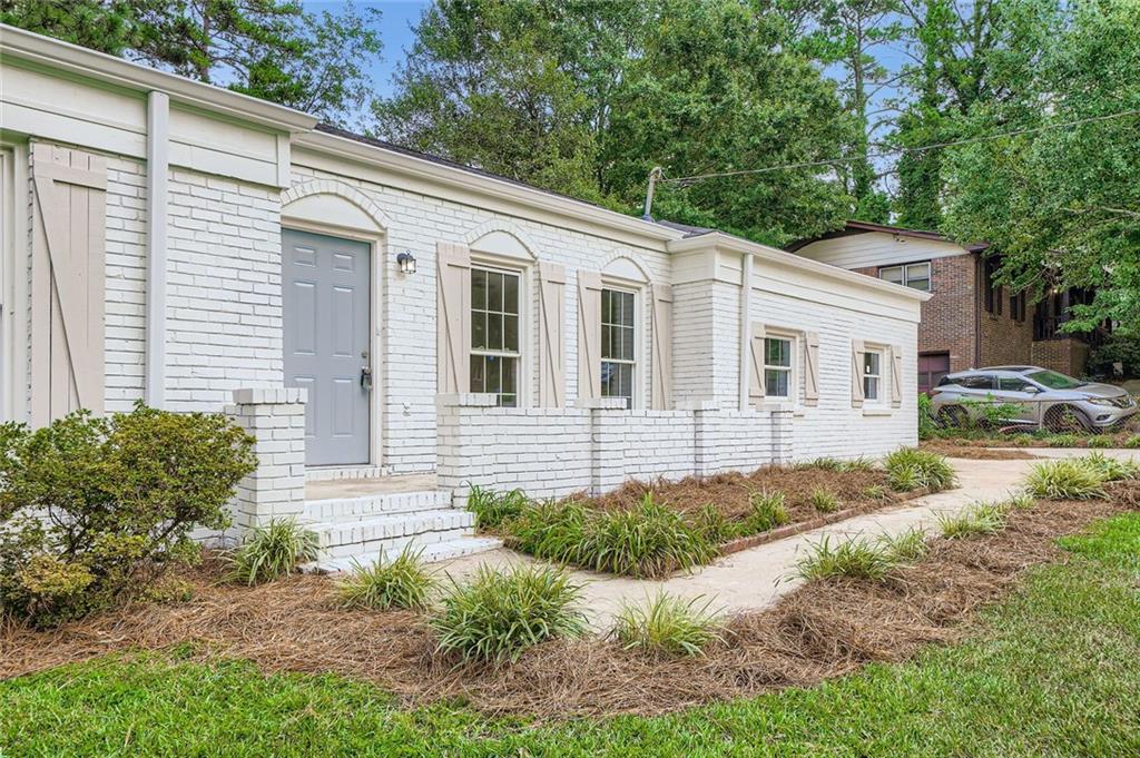 6678 Collier Way Riverdale, GA 30296 - Photo 3 of 29 a view of a house with backyard and trees around
