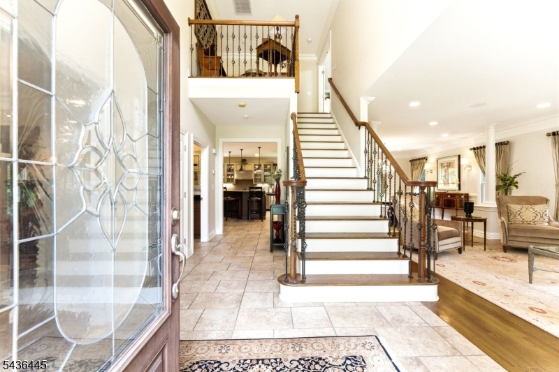 4 Windemere Way Sparta, NJ 07871 - Photo 5 of 50 a view of a hallway with wooden floor and staircase