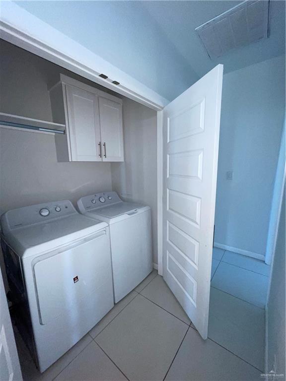 404 Rafael Drive, Unit 1 San Juan, TX 78589 - Photo 15 of 16 a utility room with cabinets washer and dryer