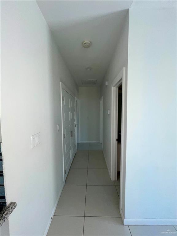 404 Rafael Drive, Unit 1 San Juan, TX 78589 - Photo 6 of 16 a view of hallway with a window and a refrigerator