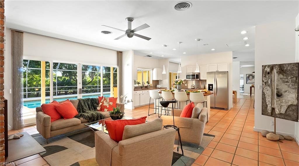 586 Yucca Road Naples, FL 34102 - Photo 7 of 26 Living area with light tile patterned floors, ceiling fan, and recessed lighting