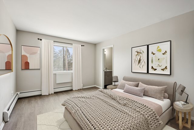 1111 Bloomingdale Road, Unit 2A Glendale Heights, IL 60139 - Photo 11 of 26 a bedroom with a large bed and a window