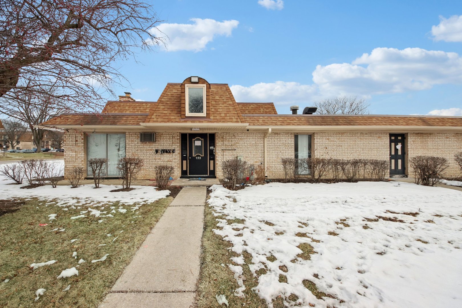 1111 Bloomingdale Road, Unit 2A Glendale Heights, IL 60139 - Photo 24 of 26 a front view of a house with a yard