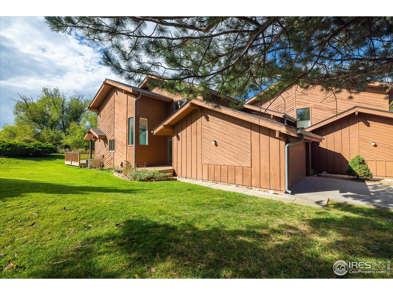 1209 Harrison Court Boulder, CO 80303 - Photo 2 of 35 a view of a backyard with barn and wooden fence