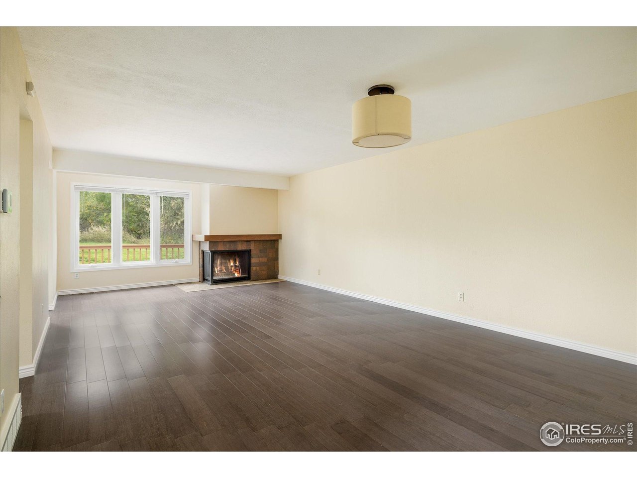 1209 Harrison Court Boulder, CO 80303 - Photo 8 of 35 a view of empty room with wooden floor