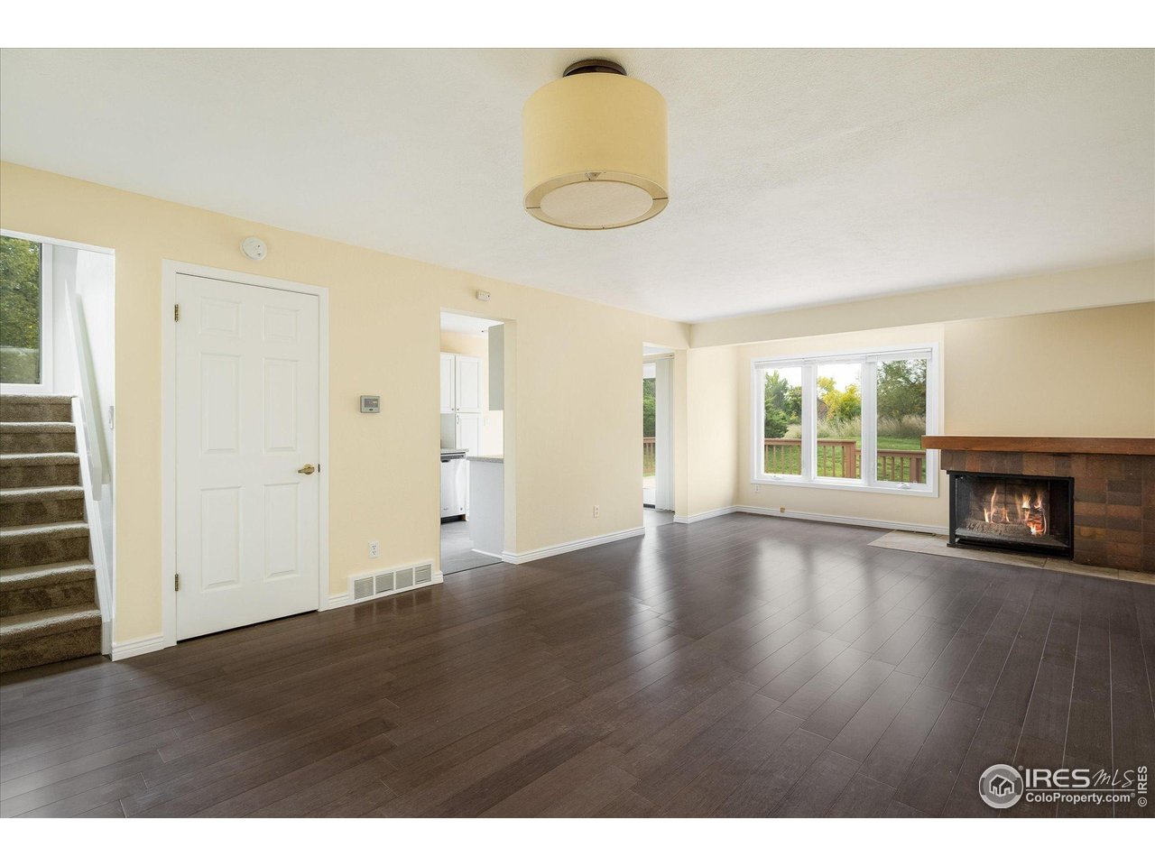 1209 Harrison Court Boulder, CO 80303 - Photo 10 of 35 a view of a room with wooden floor and window