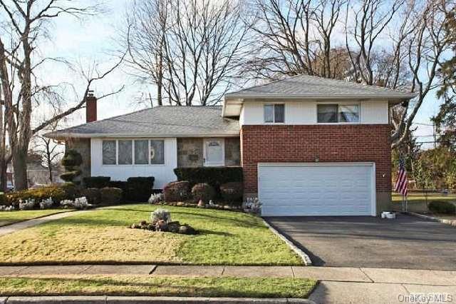 2 Westminster Road Syosset, NY 11791 - Photo 1 of 1 a front view of a house with a yard