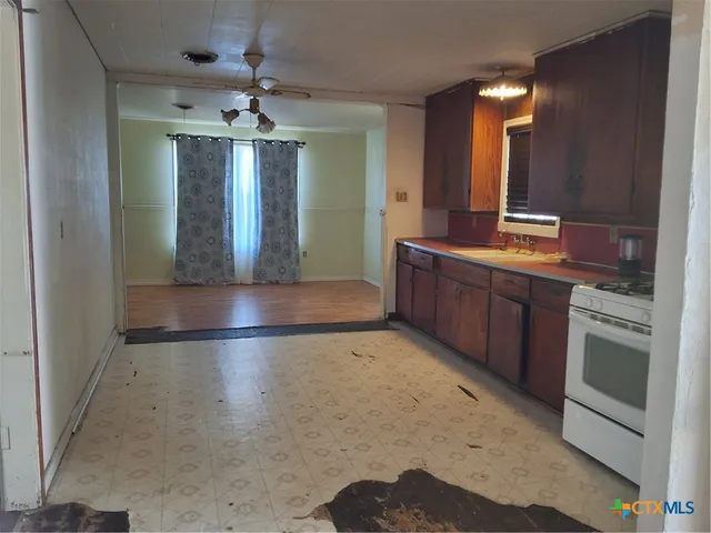 a view of a kitchen cabinets and a wooden floor