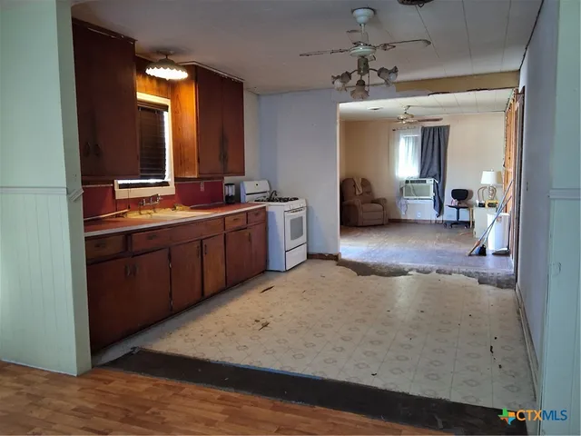 a large bathroom with a sink and a mirror