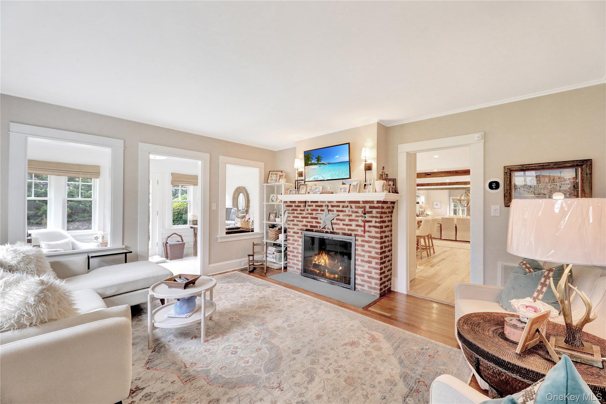 198 South Country Road Remsenburg, NY 11960 - Photo 14 of 49 a living room with furniture and a fireplace
