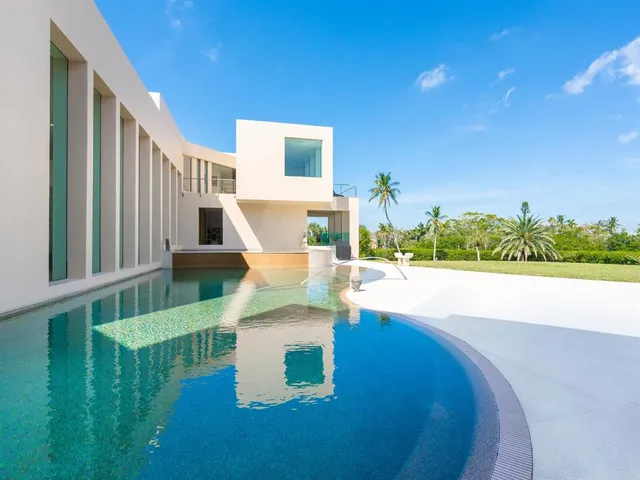 a view of a a dining room with furniture window and wooden floor