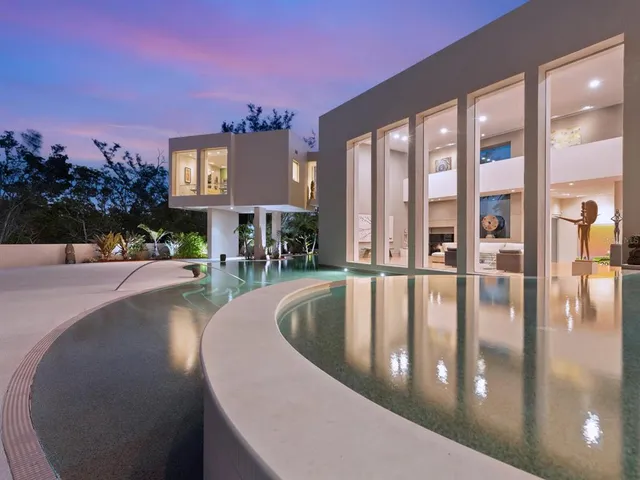a view of a swimming pool with a chairs
