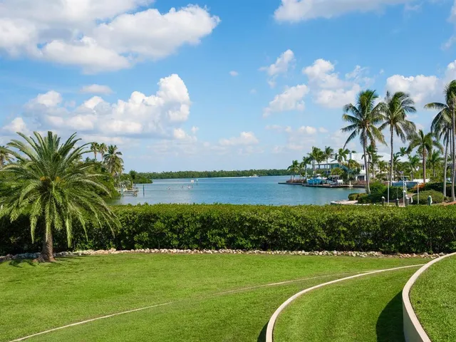 a spacious bedroom with a large bed and a large closet