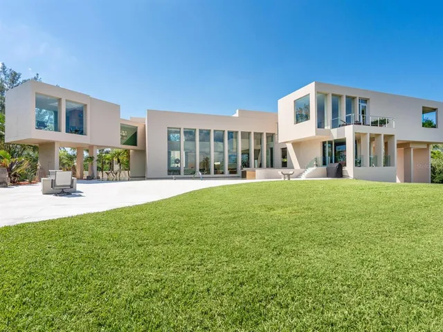 an outdoor living room with furniture and a window