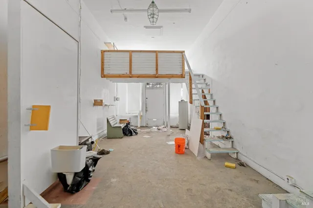 a view of hall way with furniture