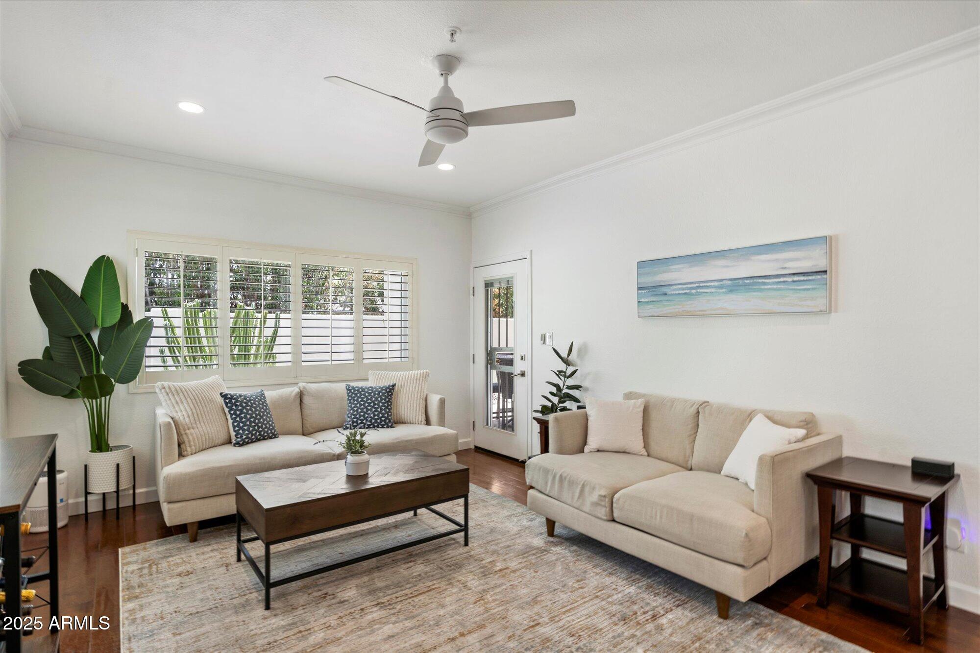 7710 East Gainey Ranch Road, Unit 139 Scottsdale, AZ 85258 - Photo 12 of 38 a living room with furniture and a large window