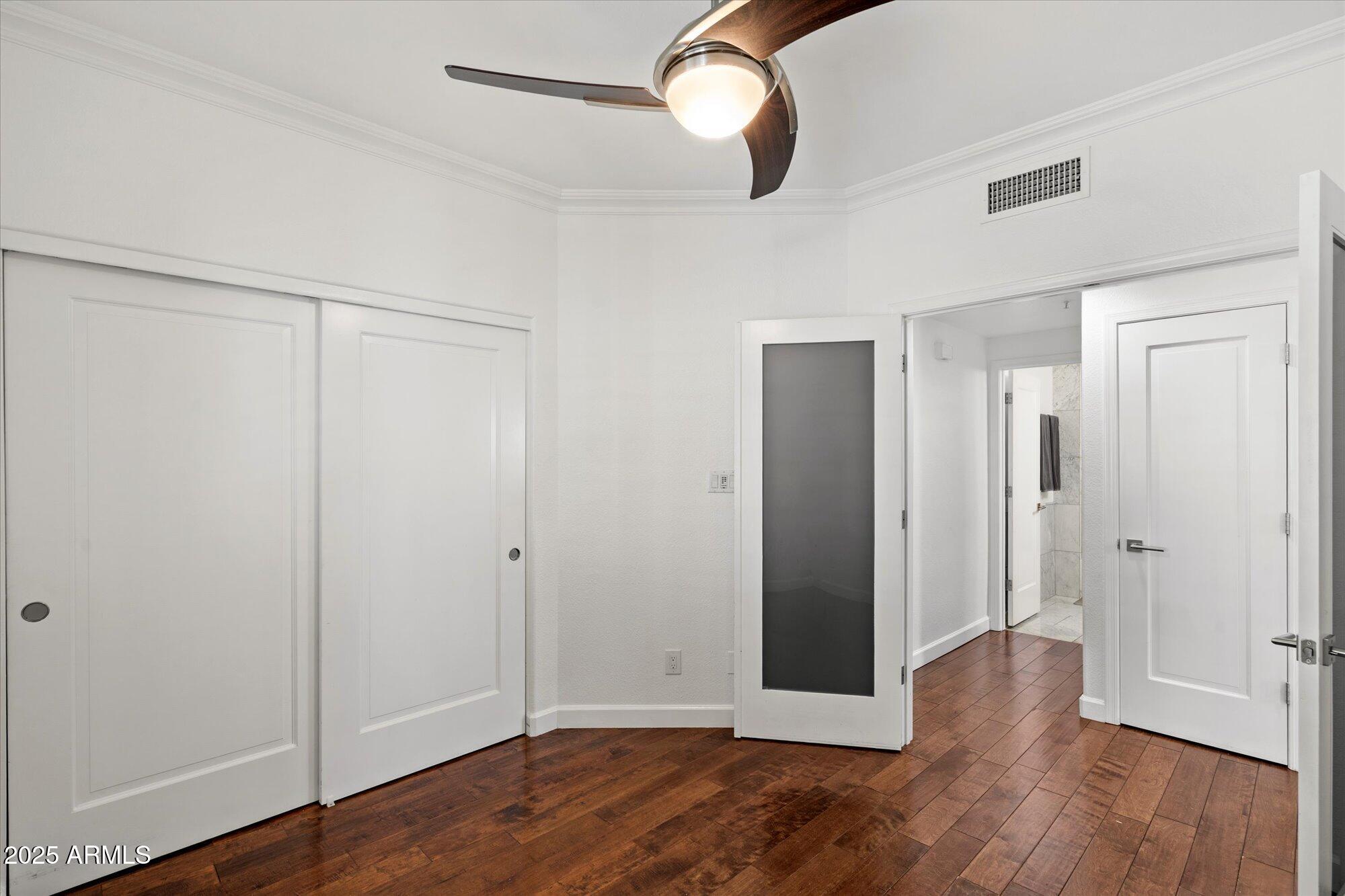 7710 East Gainey Ranch Road, Unit 139 Scottsdale, AZ 85258 - Photo 23 of 38 a view of empty room with wooden floor