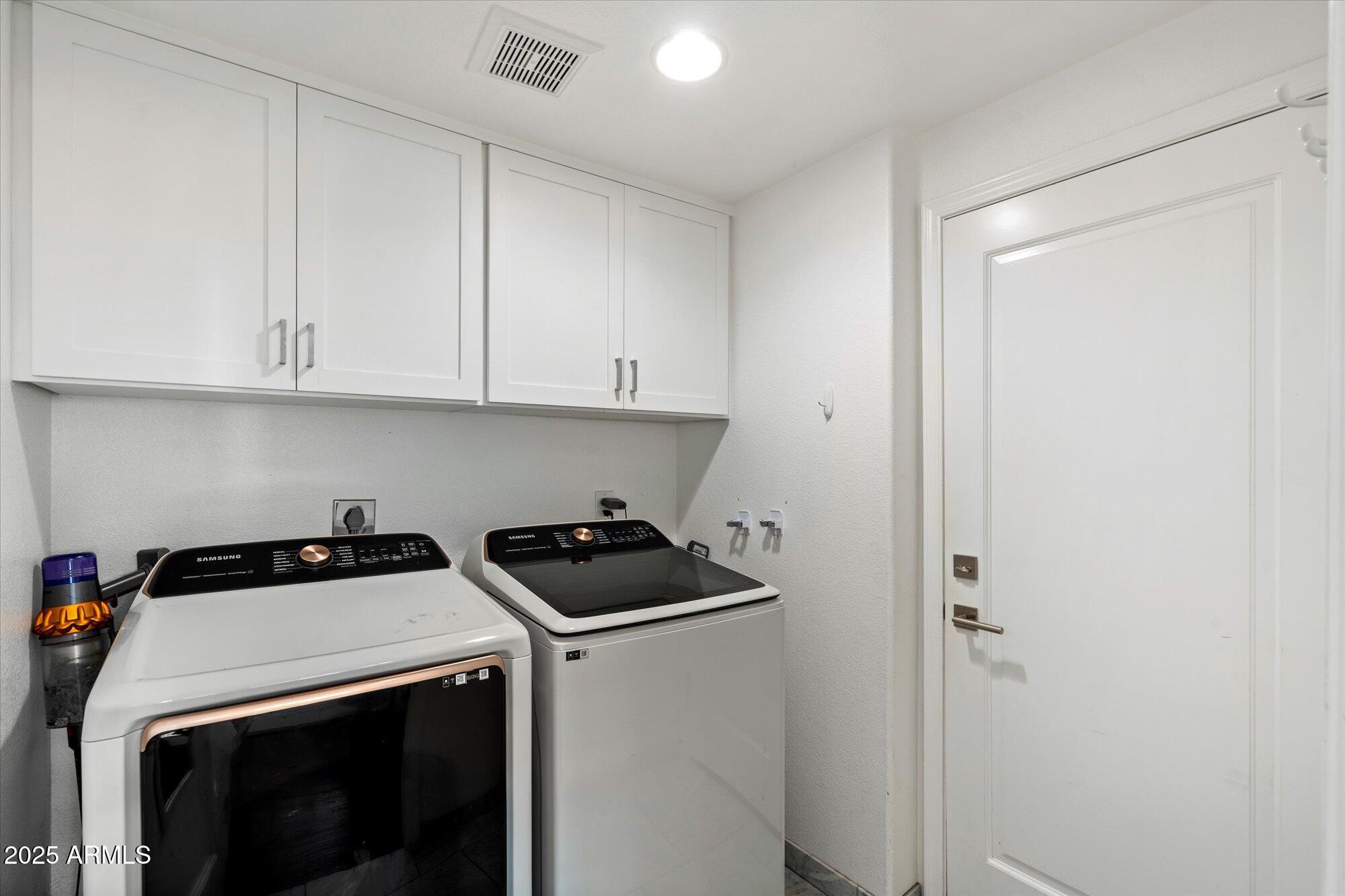 7710 East Gainey Ranch Road, Unit 139 Scottsdale, AZ 85258 - Photo 25 of 38 a view of storage and utility room with washer and dryer
