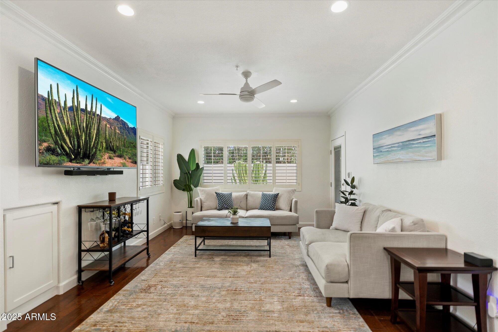 7710 East Gainey Ranch Road, Unit 139 Scottsdale, AZ 85258 - Photo 28 of 38 a living room with furniture and a flat screen tv