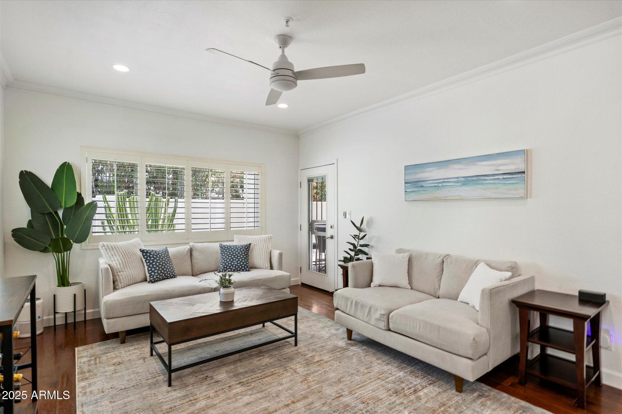 7710 East Gainey Ranch Road, Unit 139 Scottsdale, AZ 85258 - Photo 29 of 38 a living room with furniture and a large window