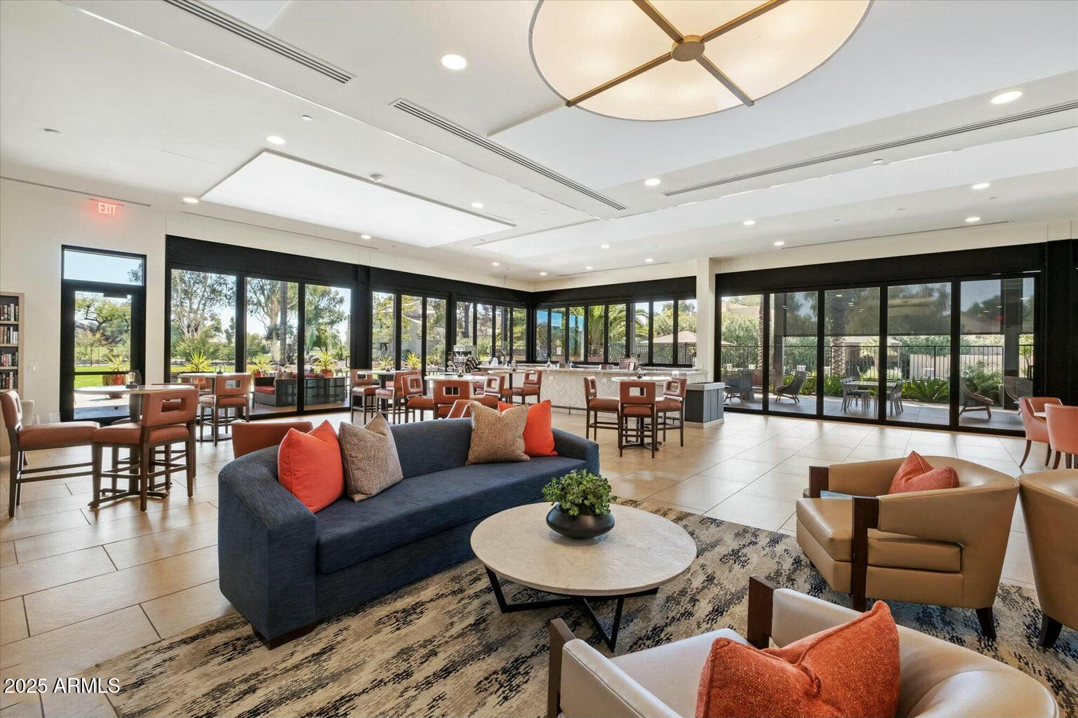 7710 East Gainey Ranch Road, Unit 139 Scottsdale, AZ 85258 - Photo 31 of 38 a living room with furniture and a large window